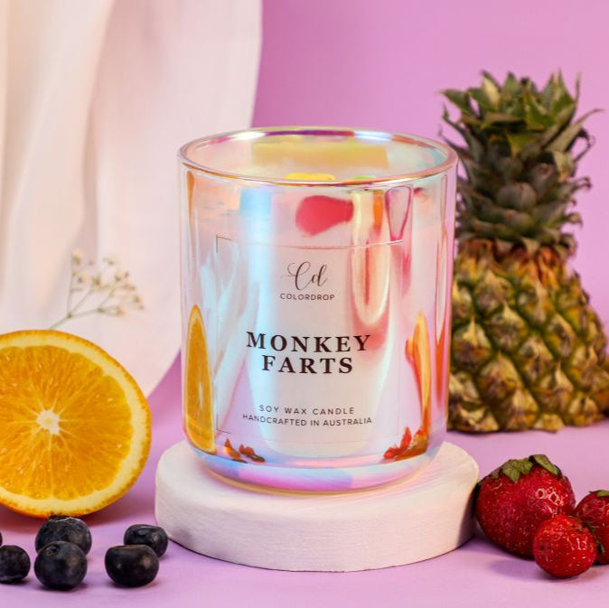 Monkey Farts Soy candle is a delightful blend of tropical fruits, including banana, pineapple, and juicy berries, with hints of coconut and vanilla.